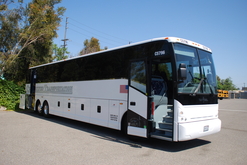 Motor Coach stopped with both the Front and Wheelchair Passenger Doors Open