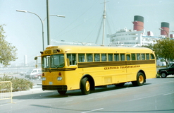 Old School Bus in front of an Oceanliner